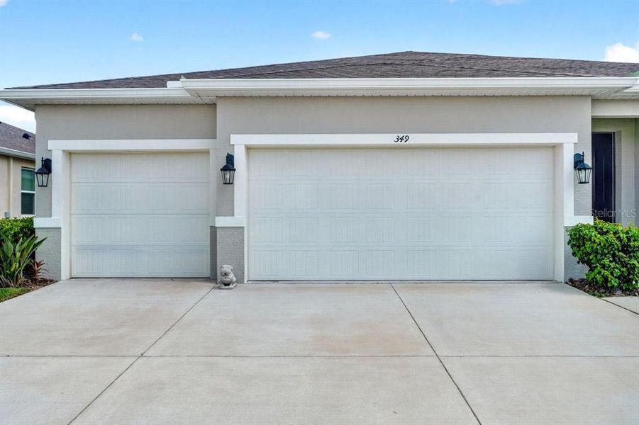 Front exterior of a new home in Archers Mill, Ormond Beach, FL, highlighting curb appeal (Image 25).