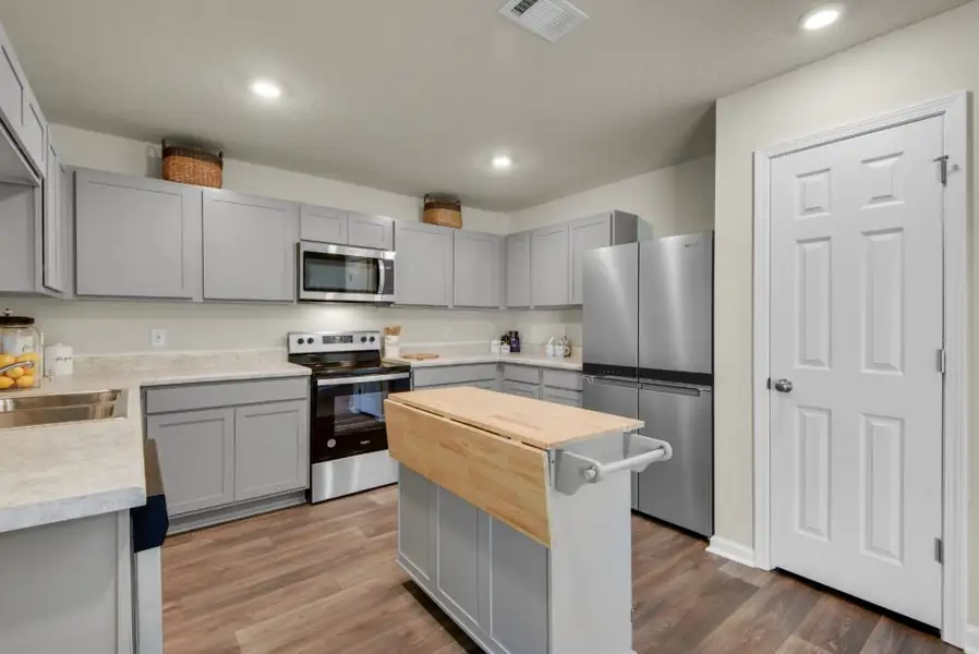 Furnished interior view inside a new home in Mahogany At Jubilee, Pace (Image 5). Furnished interior view inside a new home in Mahogany At Jubilee, Pace (Image 5).