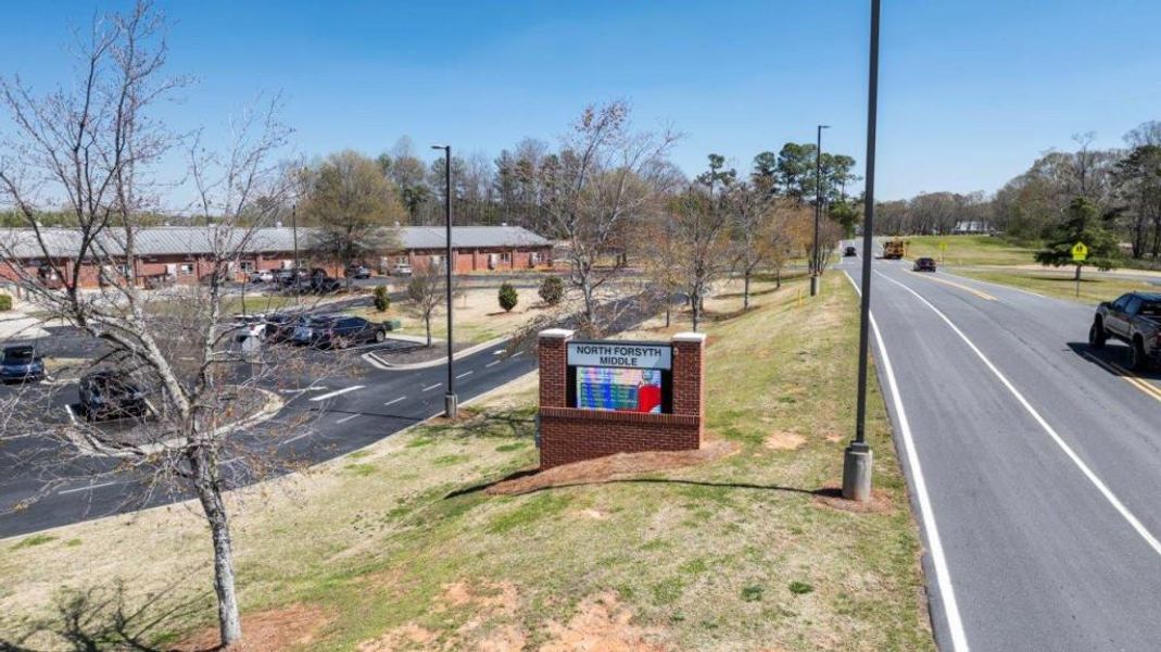 Front exterior of a new home in Haven Abbey, Cumming, GA, highlighting curb appeal (Image 49). Front exterior of a new home in Haven Abbey, Cumming, GA, highlighting curb appeal (Image 49).