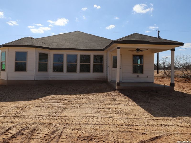 Exterior details and patio area of a home in Chaparral Ranch, Floresville (Image 4).
