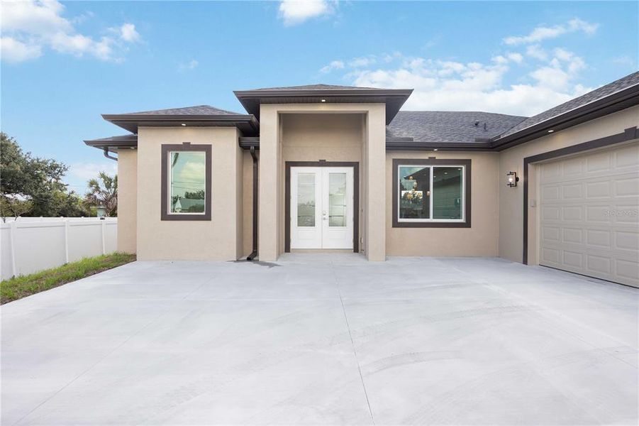 Front exterior of a new home in , Englewood, FL, highlighting curb appeal (Image 17).