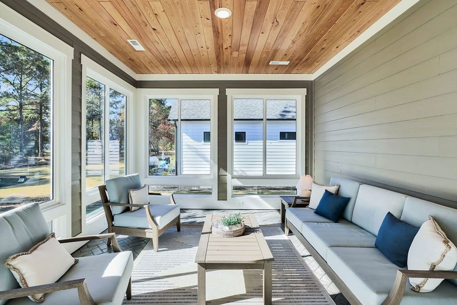 Exterior details and patio area of a home in The Bluffs On the Cape Fear, Leland (Image 28).