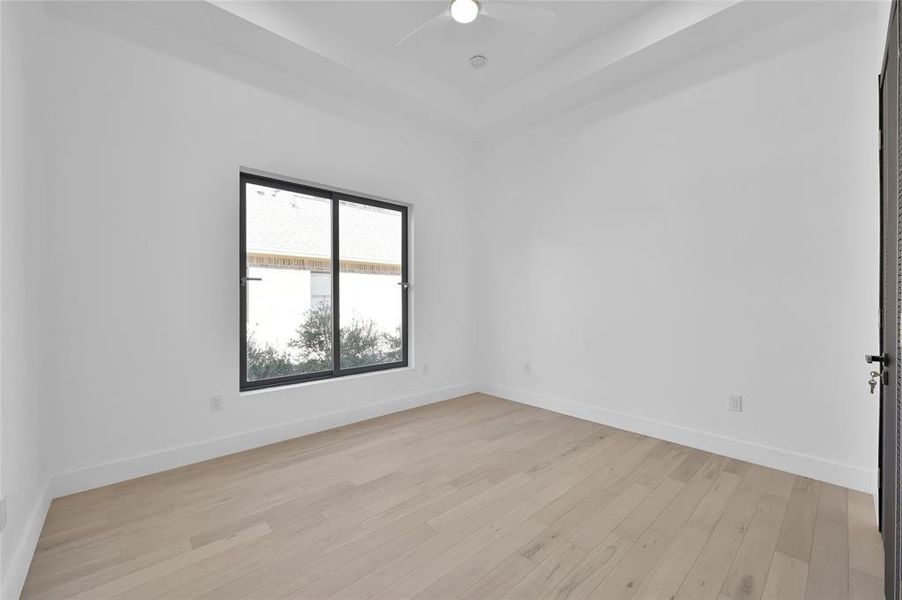 Bedroom 3, located at the back of the house, features a full bathroom that connects to bedroom 4 with a double vanity for added convenience and privacy.