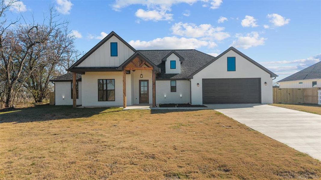 Front exterior of a new home in , Lindale, TX, highlighting curb appeal (Image 27).