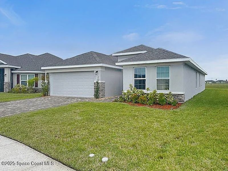 Exterior details and patio area of a home in Courtyard at Waterstone, Palm Bay (Image 2). Exterior details and patio area of a home in Courtyard at Waterstone, Palm Bay (Image 2).