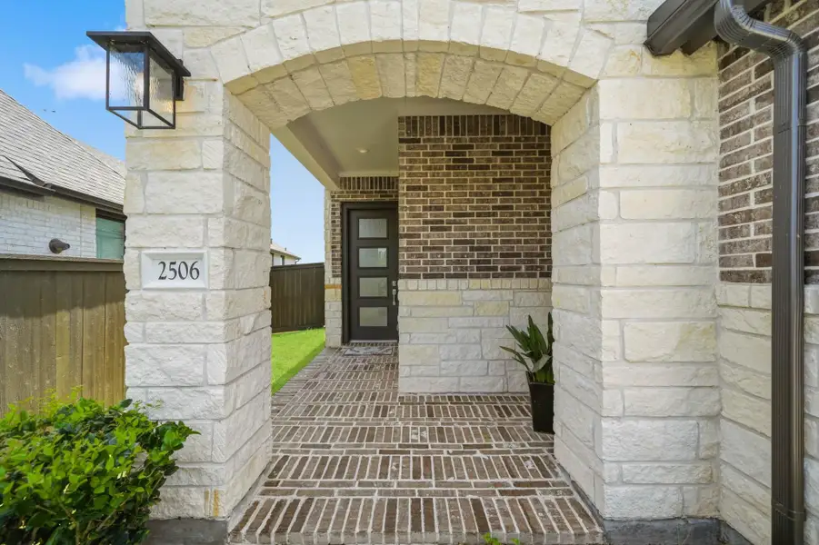 Covered front porch with stylish architecture and inviting entryway. Covered front porch with stylish architecture and inviting entryway.