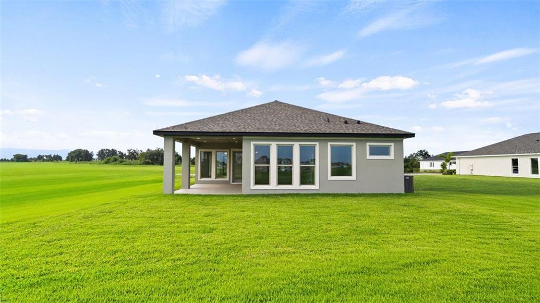 Front exterior of a new home in Mandarin Grove, Palmetto, FL, highlighting curb appeal (Image 2).