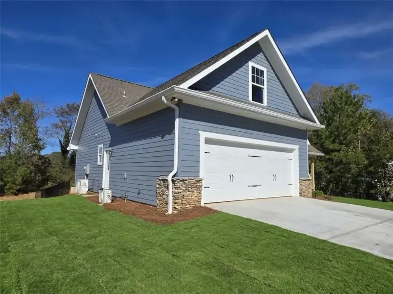 Front exterior of a new home in , Gainesville, GA, highlighting curb appeal (Image 2). Front exterior of a new home in , Gainesville, GA, highlighting curb appeal (Image 2).