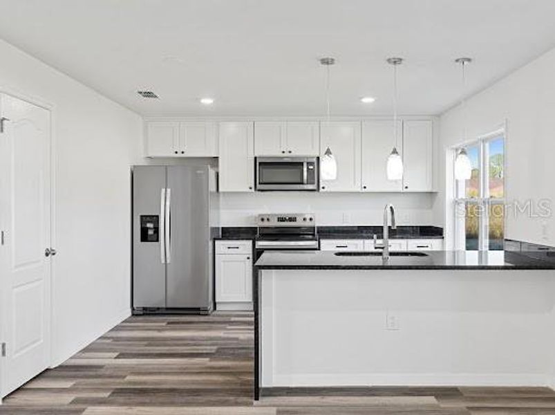 Furnished interior view inside a new home in , Kissimmee (Image 4). Furnished interior view inside a new home in , Kissimmee (Image 4).