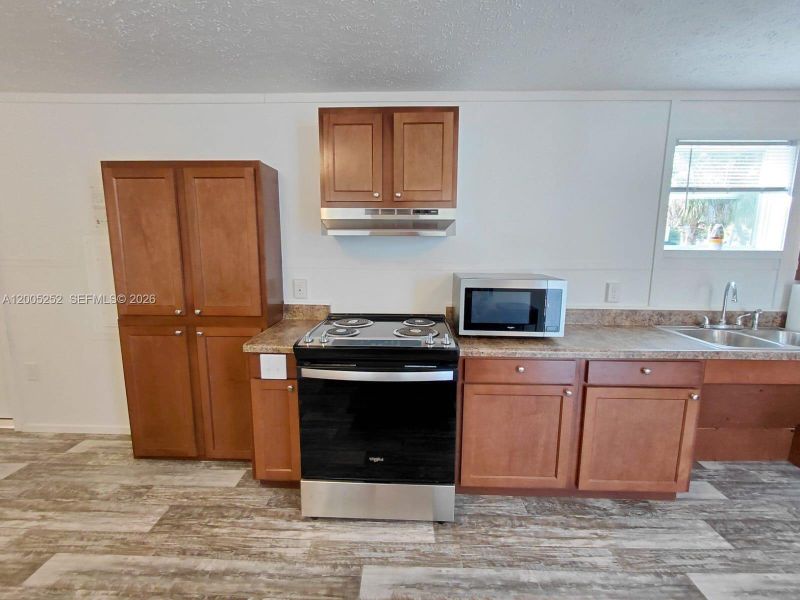Furnished interior view inside a new home in , Clewiston (Image 9).
