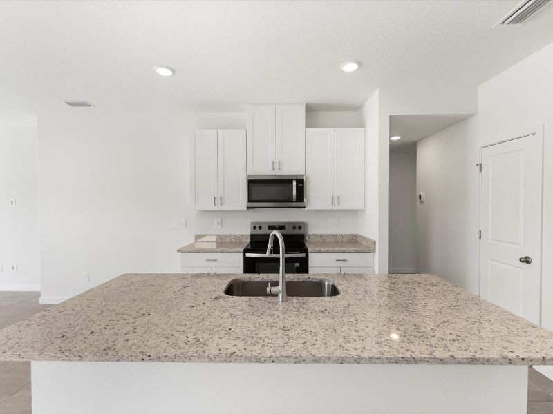 Furnished interior view inside a new home in Flagler Village - Classic Series, Palm Coast (Image 6). Furnished interior view inside a new home in Flagler Village - Classic Series, Palm Coast (Image 6).