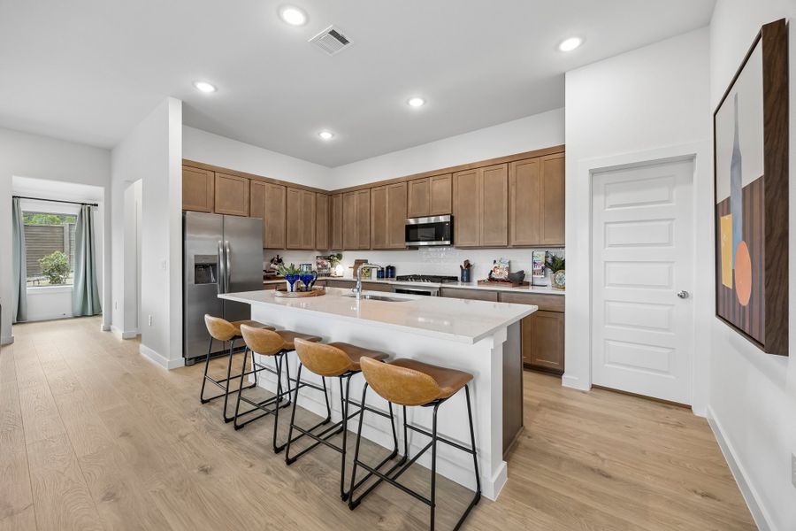 Kitchen in the Pecos home plan by Trophy Signature Homes – REPRESENTATIVE PHOTO