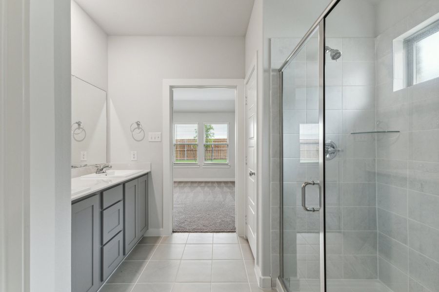 Primary Bathroom in the Oscar home plan by Trophy Signature Homes – REPRESENTATIVE PHOTO