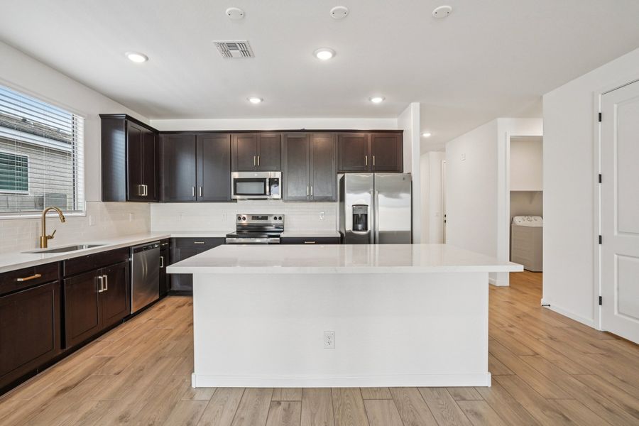 Kitchen featuring the Oxford Collection. Finishes and colors may vary by community.