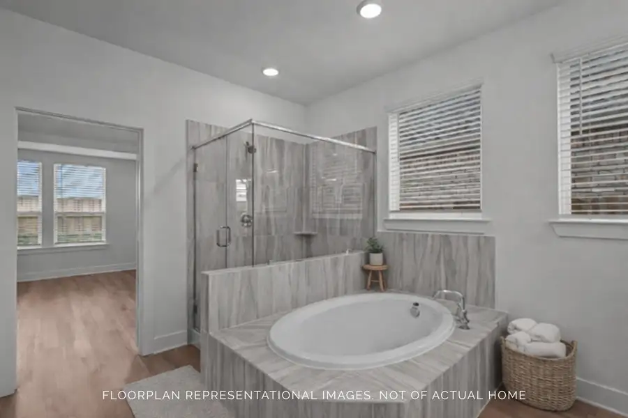 Furnished interior view inside a new home in The Oaks on 6th Street, Magnolia (Image 9).