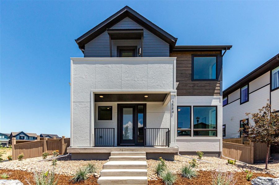 Front exterior of a new home in West Grange, Longmont, CO, highlighting curb appeal (Image 28).