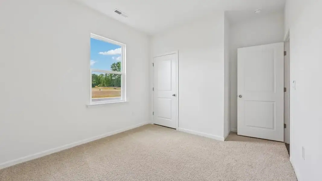 Spacious, unfurnished interior of a new home in The Villas at Laurel Oaks, Sanford (Image 14).