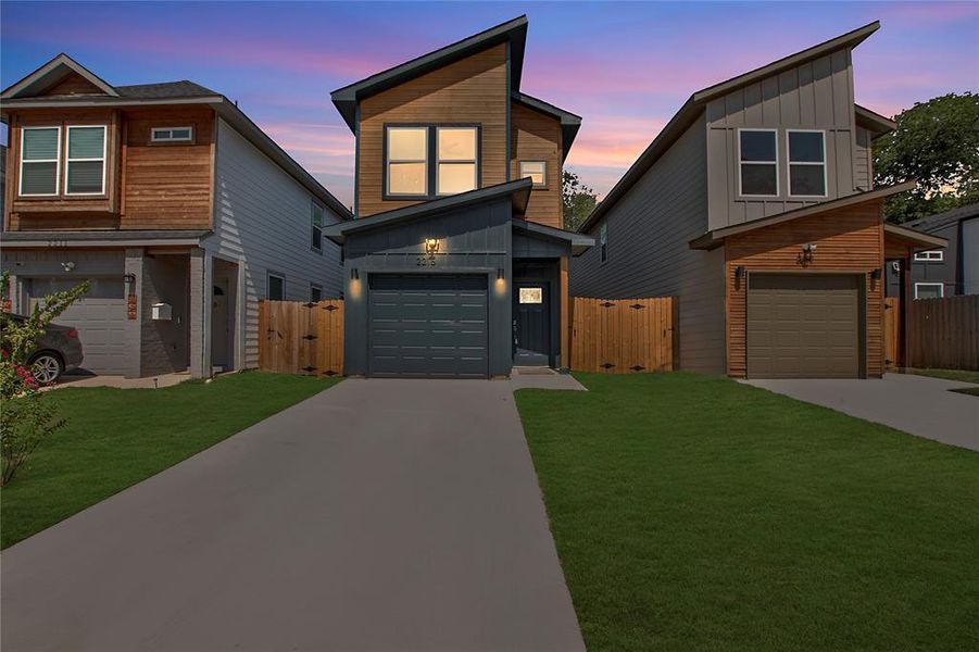 Contemporary house with a lawn and a garage