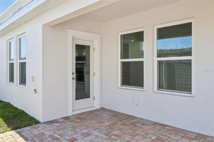 Exterior details and patio area of a home in Cyrene at Harmony, St. Cloud (Image 23).
