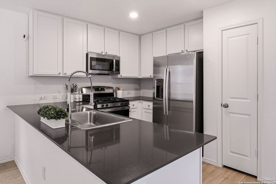 Furnished interior view inside a new home in Aston Park: Wellton Collection, San Antonio (Image 6).