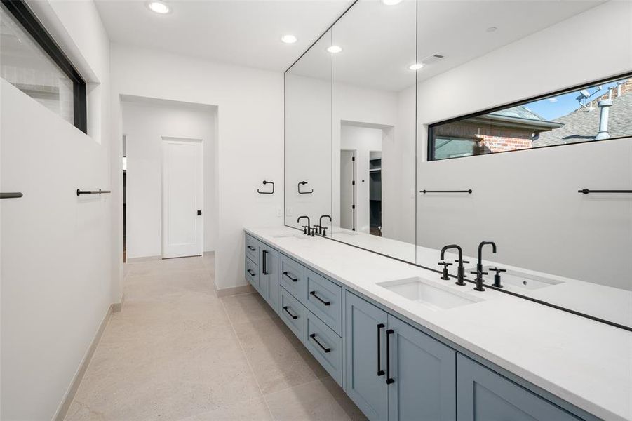 Bathroom featuring tile patterned flooring and vanity