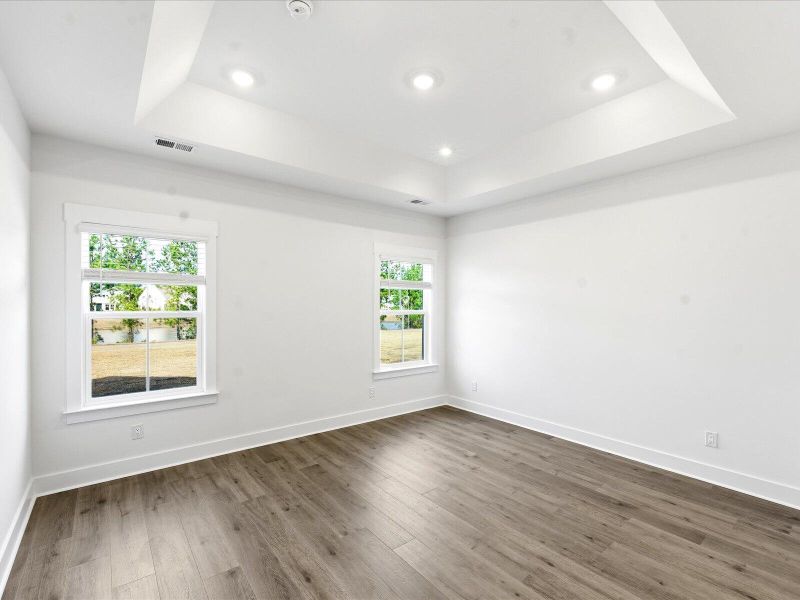Spacious, unfurnished interior of a new home in The Coves at Lakes of Cane Bay II, Summerville (Image 28).