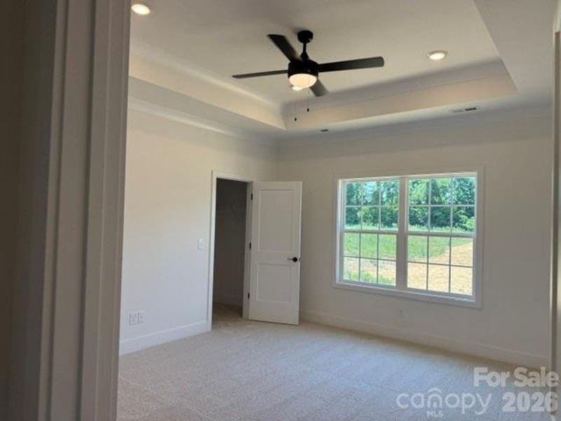 Primary Bedroom with tray ceiling Primary Bedroom with tray ceiling