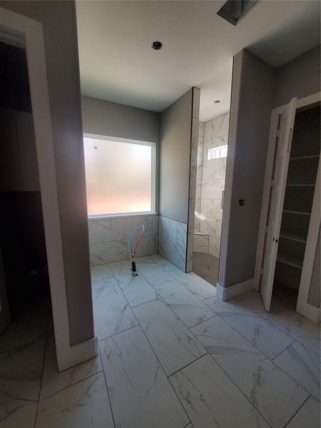 STAND ALONE TUB LOCATION IN PRIMARY BATH WITH MASSIVE SHOWER NEXT TO IT.
