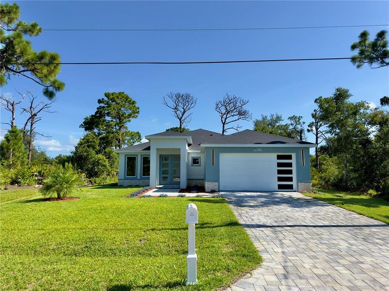 Front exterior of a new home in , Rotonda West, FL, highlighting curb appeal (Image 29). Front exterior of a new home in , Rotonda West, FL, highlighting curb appeal (Image 29).