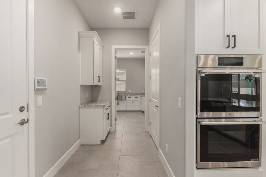 Furnished interior view inside a new home in Bellero Estates, Queen Creek (Image 9).