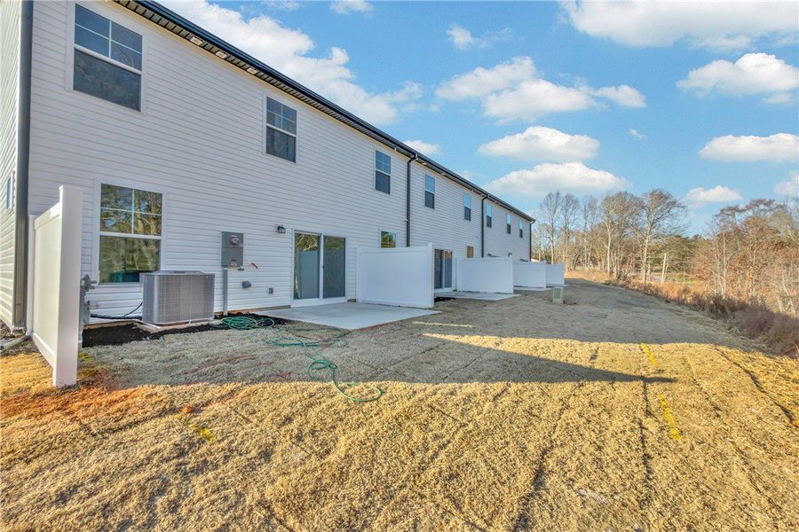 Exterior details and patio area of a home in Meece Townhomes, Easley (Image 17). Exterior details and patio area of a home in Meece Townhomes, Easley (Image 17).