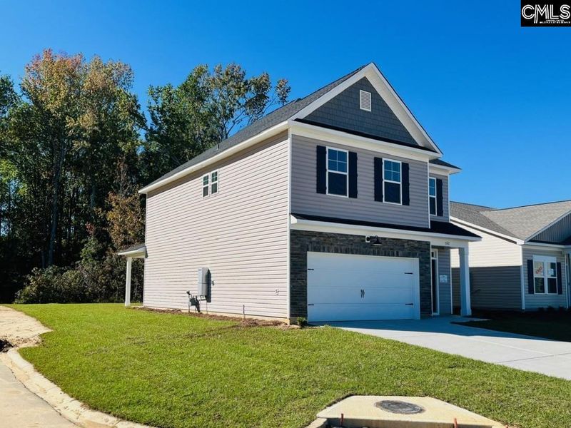 Front exterior of a new home in Blythewood Farms, Blythewood, SC, highlighting curb appeal (Image 2). Front exterior of a new home in Blythewood Farms, Blythewood, SC, highlighting curb appeal (Image 2).