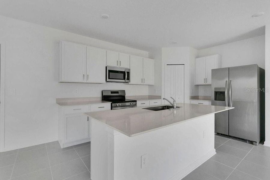 Furnished interior view inside a new home in Peace Creek Reserve, Winter Haven (Image 5).