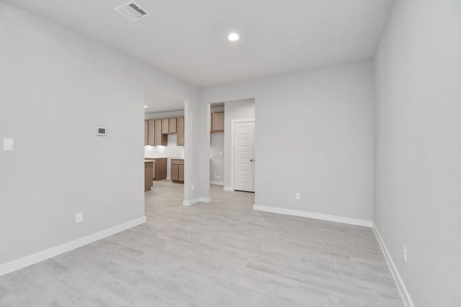 Make memories gathered around the table with your family and friends! This spacious dining room features elegant flooring, custom paint, and adjacent to family room and kitchen for open concept feel. Sample photo of completed home with similar floor plan. Actual colors and selections may vary. Make memories gathered around the table with your family and friends! This spacious dining room features elegant flooring, custom paint, and adjacent to family room and kitchen for open concept feel. Sample photo of completed home with similar floor plan. Actual colors and selections may vary.