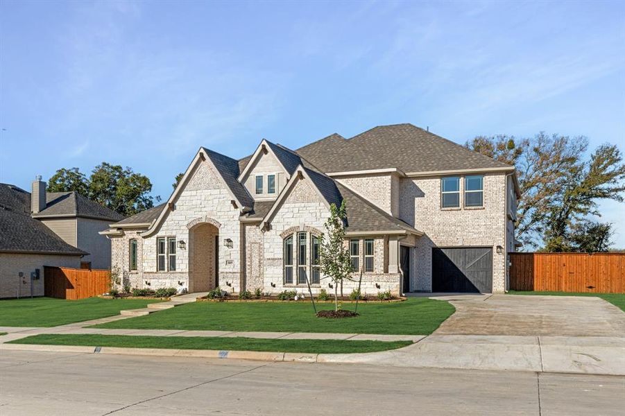 Front exterior of a new home in Hayes Crossing, Midlothian, TX, highlighting curb appeal (Image 1).
