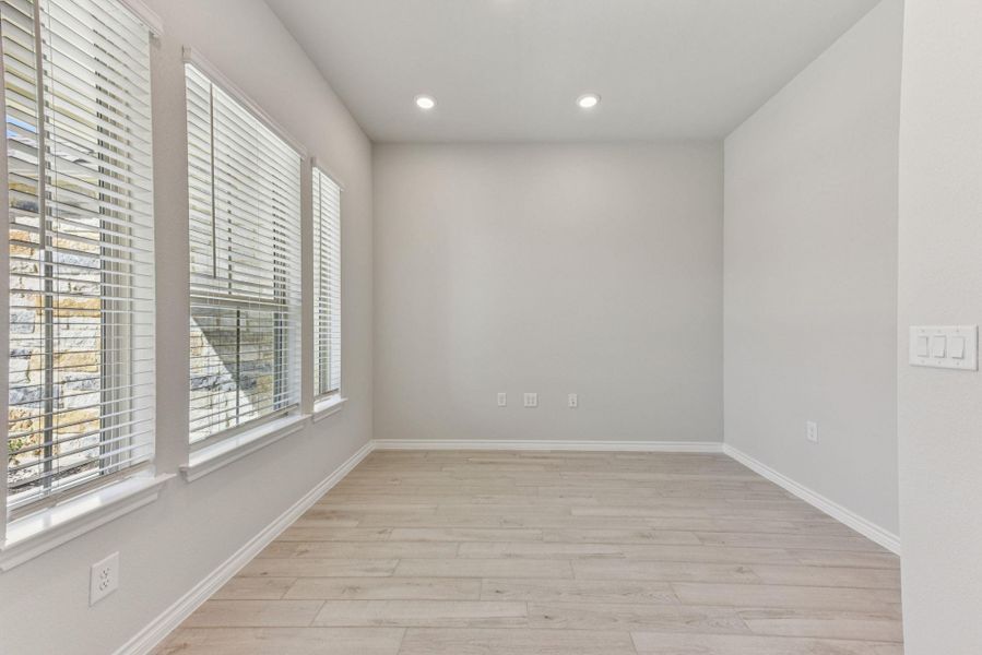 Empty room featuring light wood-style flooring and recessed lighting Empty room featuring light wood-style flooring and recessed lighting
