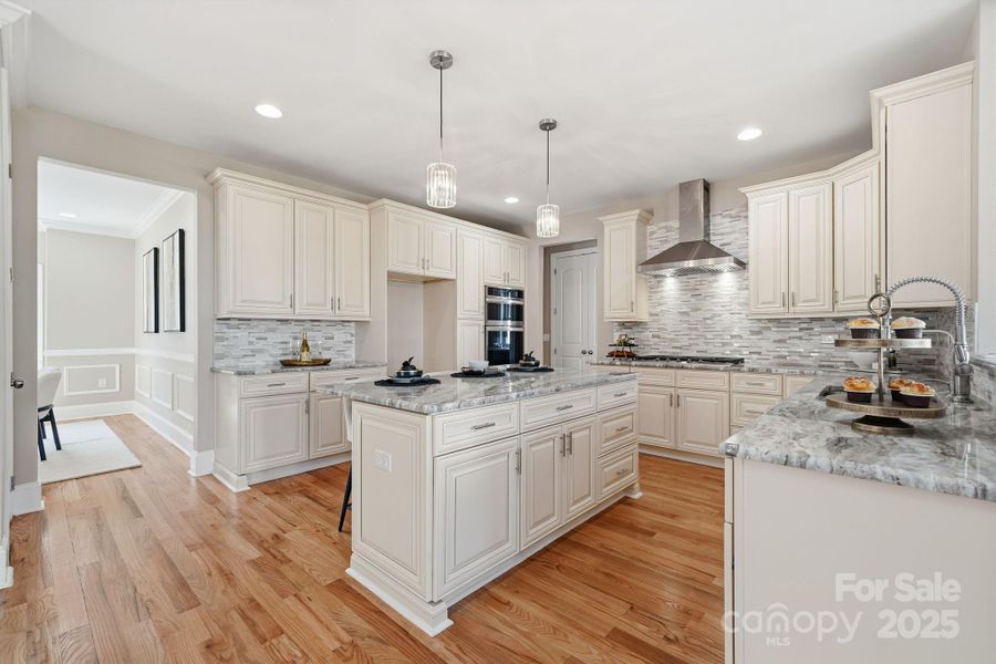 Chef’s kitchen with stainless steel appliances, decorative backsplash, and expansive prep space. Chef’s kitchen with stainless steel appliances, decorative backsplash, and expansive prep space.