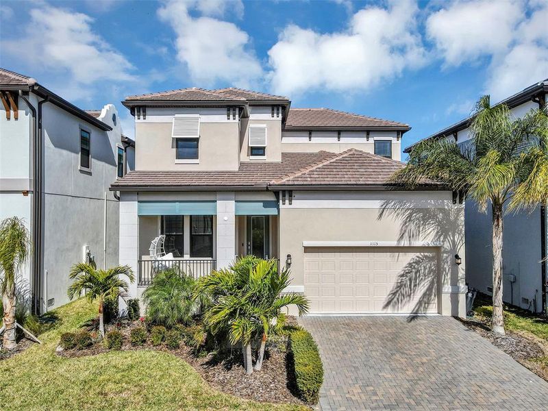 Front exterior of a new home in SouthShore Yacht Club: Somerset Preserve, Ruskin, FL, highlighting curb appeal (Image 1). Front exterior of a new home in SouthShore Yacht Club: Somerset Preserve, Ruskin, FL, highlighting curb appeal (Image 1).