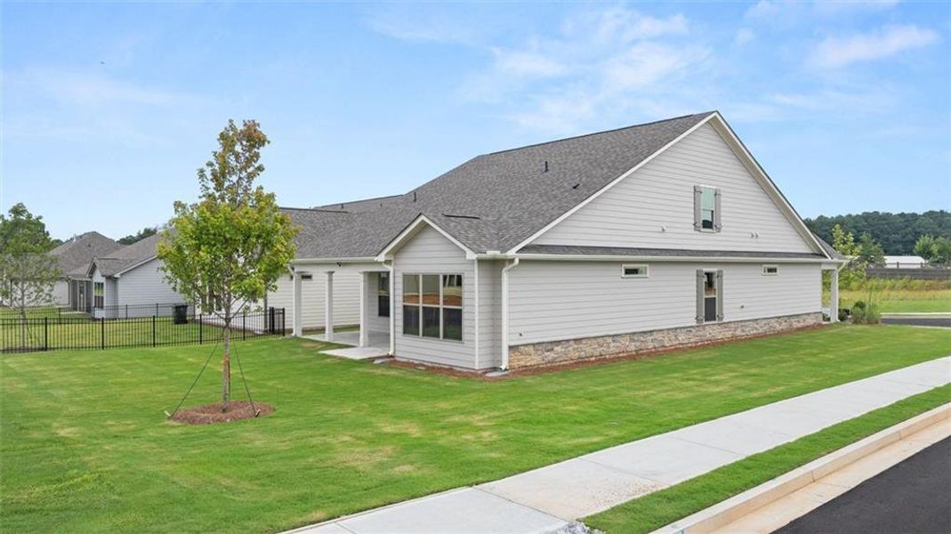Front exterior of a new home in Soleil Summit Chase, Snellville, GA, highlighting curb appeal (Image 28). Front exterior of a new home in Soleil Summit Chase, Snellville, GA, highlighting curb appeal (Image 28).