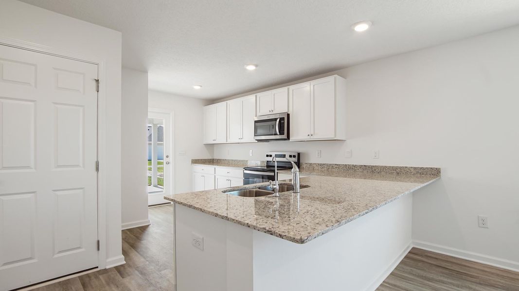 Furnished interior view inside a new home in Owl's Head East, Freeport (Image 5).