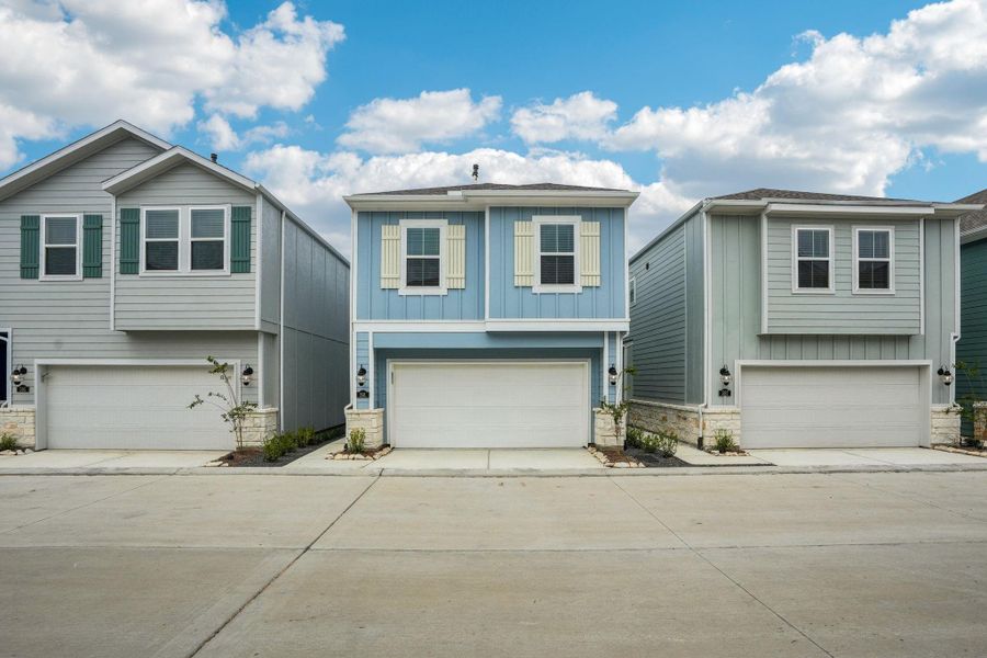 Front exterior of a new home in Kemah Crossing - City Series, Kemah, TX, highlighting curb appeal (Image 25). Front exterior of a new home in Kemah Crossing - City Series, Kemah, TX, highlighting curb appeal (Image 25).