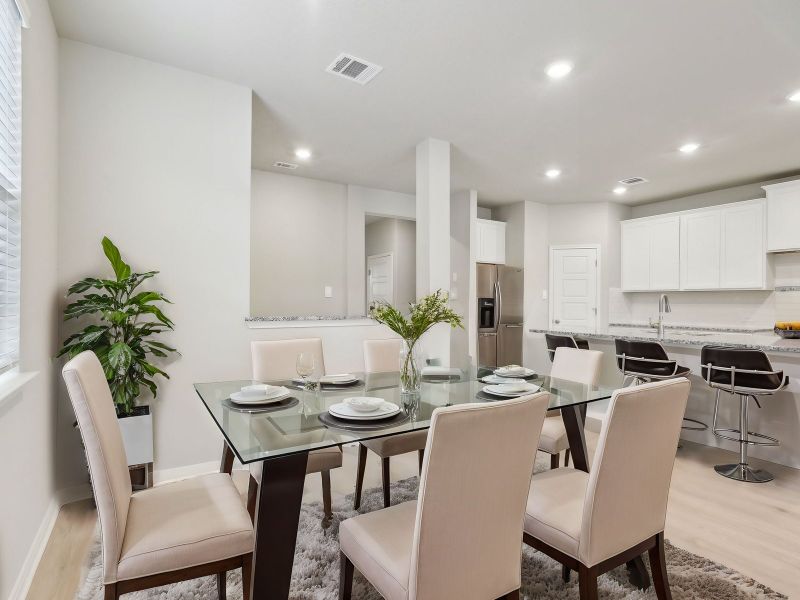 Virtually staged dining room in the San Jacinto floorplan at a Meritage Homes community.