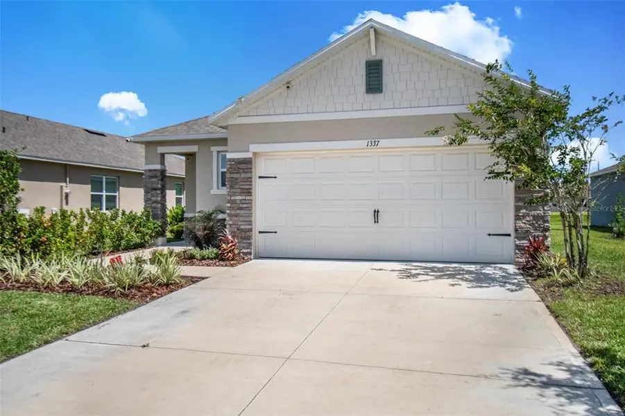Front exterior of a new home in , Ormond Beach, FL, highlighting curb appeal (Image 2). Front exterior of a new home in , Ormond Beach, FL, highlighting curb appeal (Image 2).