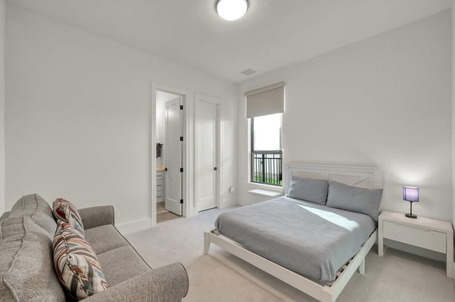 Large enough to accommodate both a bed and sitting area, this first-floor suite is ideal for guests or multigenerational living.