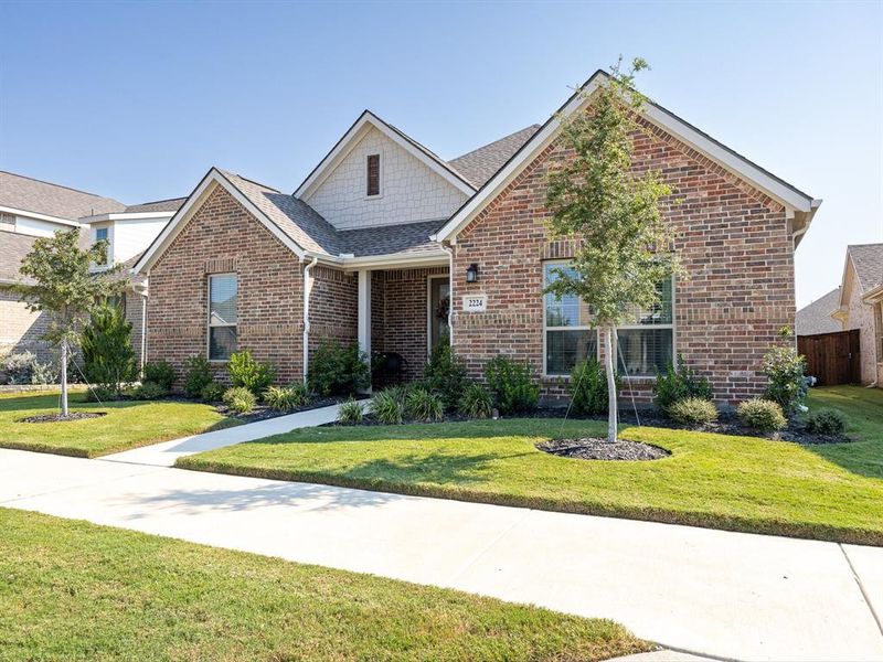 Front exterior of a new home in , Waxahachie, TX, highlighting curb appeal (Image 2). Front exterior of a new home in , Waxahachie, TX, highlighting curb appeal (Image 2).