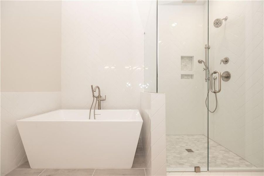 Bathroom with a soaking tub- upgraded tile and decorative touches - Image is of previously built Chamberlain