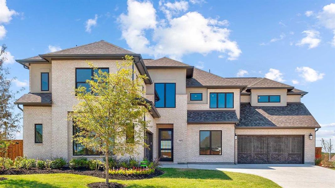 Front exterior of a new home in Terraces 82'/100', Rockwall, TX, highlighting curb appeal (Image 2).