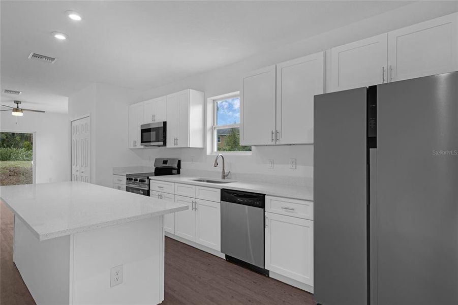 Ceiling fans throughout the house * plenty oi receptacles * luxury vinyl flooring * laundry room area