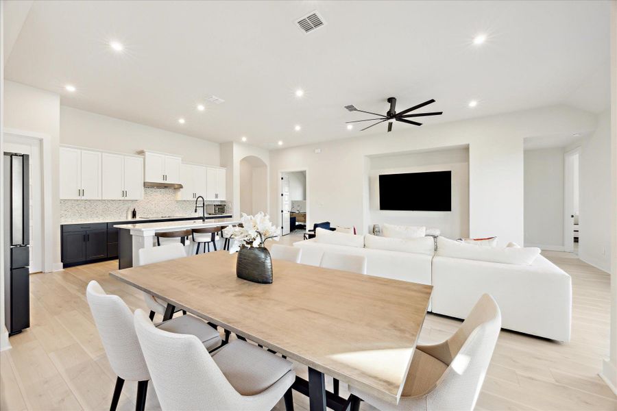 Dining space with recessed lighting allowing for a clean modern style