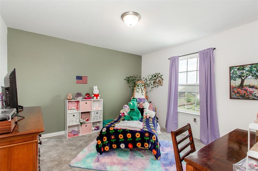 Bedroom with carpet and baseboards